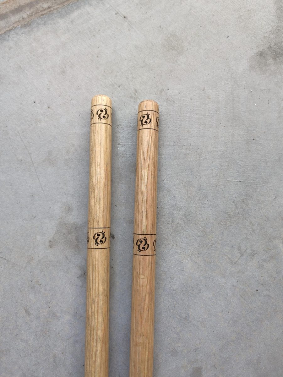 Wooden sticks with laser engraved logo bands